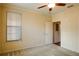 Bedroom with ceiling fan, window with blinds, and carpet at 4221 W Spruce St # 1310, Tampa, FL 33607