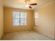 Bedroom with ceiling fan and large windows at 4221 W Spruce St # 1310, Tampa, FL 33607