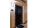 Private condo entrance with a black door and welcome mat at 4221 W Spruce St # 1310, Tampa, FL 33607