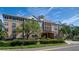 Luxury apartment building with a gated entrance and landscaping at 4221 W Spruce St # 1310, Tampa, FL 33607