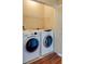 Laundry room with washer and dryer, and shelving at 4221 W Spruce St # 1310, Tampa, FL 33607