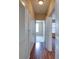 Long hallway with wood floors and access to other rooms at 4221 W Spruce St # 1310, Tampa, FL 33607