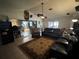 Spacious living room features a large sectional sofa and open floor plan at 6297 Harcross Ct, Spring Hill, FL 34606