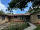 Exterior view of a ranch house with a well-maintained lawn at 6297 Harcross Ct, Spring Hill, FL 34606