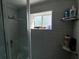 Updated bathroom with a shower and neutral tile at 6297 Harcross Ct, Spring Hill, FL 34606