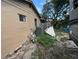 Rear view of house showing an AC unit and a partially fenced backyard at 6297 Harcross Ct, Spring Hill, FL 34606