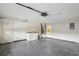 Open basement with laundry area including washer, dryer, utility sink, and access to mechanicals at 1606 Laughton Pl, Sun City Center, FL 33573