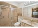 Charming bathroom with floral wallpaper, classic fixtures, and a glass-enclosed shower at 1606 Laughton Pl, Sun City Center, FL 33573