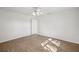 Cozy bedroom featuring wood floors, white walls, and a ceiling fan at 1606 Laughton Pl, Sun City Center, FL 33573