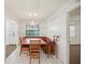 Dining area featuring a wooden table, built-in bench, and natural light at 1606 Laughton Pl, Sun City Center, FL 33573