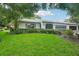 Charming home with lush landscaping and a well-maintained front yard at 1606 Laughton Pl, Sun City Center, FL 33573