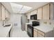 Kitchen showcasing modern appliances, bright countertops, and ample cabinet space at 1606 Laughton Pl, Sun City Center, FL 33573