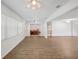 Bright and airy living room with wood floors with view to dining area at 1606 Laughton Pl, Sun City Center, FL 33573