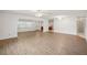 Bright living room with wood floors and a seamless open floor plan at 1606 Laughton Pl, Sun City Center, FL 33573