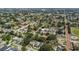 Overhead aerial shot of a neighborhood with a modern home, mature trees, and surrounding streets at 2909 W Spruce St, Tampa, FL 33607
