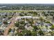 Expansive aerial view of a neighborhood with mature trees, and nearby highway at 2909 W Spruce St, Tampa, FL 33607