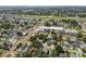 Expansive aerial view of a neighborhood with mature trees, and nearby highway at 2909 W Spruce St, Tampa, FL 33607