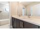 Double vanity bathroom with dark brown cabinets and white quartz countertop at 2909 W Spruce St, Tampa, FL 33607