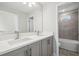 Clean bathroom features double sinks, neutral color palette, and tiled shower/tub combo at 2909 W Spruce St, Tampa, FL 33607