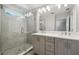 Stylish bathroom showcasing dual sink vanity, a glass-enclosed shower, and contemporary fixtures at 2909 W Spruce St, Tampa, FL 33607