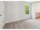 Neutral bedroom featuring a window and plush carpeting at 2909 W Spruce St, Tampa, FL 33607