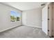 Bright bedroom with a window and plush carpeting at 2909 W Spruce St, Tampa, FL 33607