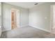 Bright bedroom with neutral walls, plush carpet, and ensuite bathroom at 2909 W Spruce St, Tampa, FL 33607
