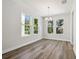 Bright dining room with ample natural light and wood-look flooring at 2909 W Spruce St, Tampa, FL 33607