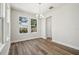Dining room with contemporary lighting and bright windows at 2909 W Spruce St, Tampa, FL 33607