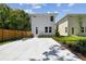 Modern two-story home with clean lines, long driveway and lush landscaping, offering great curb appeal at 2909 W Spruce St, Tampa, FL 33607