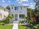 Beautiful two-story home featuring lush landscaping and a modern design at 2909 W Spruce St, Tampa, FL 33607