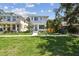 Modern two-story home with fresh landscaping, green grass and a contemporary design at 2909 W Spruce St, Tampa, FL 33607