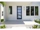 Welcoming front porch with a stylish entry door and bright natural light at 2909 W Spruce St, Tampa, FL 33607