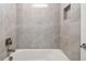 Bathroom shower and tub area with tile surround and recessed niche at 2909 W Spruce St, Tampa, FL 33607