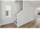 Interior shot featuring wood-look floors and staircase with white trim at 2909 W Spruce St, Tampa, FL 33607