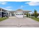 Single-wide mobile home with carport and landscaped front at 4845 Elwana Way, Zephyrhills, FL 33541