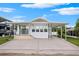 White mobile home with covered porch at 4845 Elwana Way, Zephyrhills, FL 33541