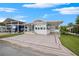 Single-wide mobile home with carport and landscaped front at 4845 Elwana Way, Zephyrhills, FL 33541