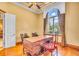Home office with hardwood floors, large window, and custom built-in desk at 19451 Ganton Ave, Bradenton, FL 34202