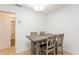 Small dining area with grey table and four chairs at 11200 102Nd Ave # 60, Seminole, FL 33778