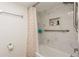 Clean bathroom featuring a bathtub and shower with a rainbow shower curtain at 11200 102Nd Ave # 60, Seminole, FL 33778