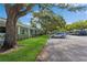 Exterior view of building with ample parking and mature landscaping at 11200 102Nd Ave # 60, Seminole, FL 33778