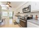 Modern kitchen with stainless steel appliances and light cabinets at 11200 102Nd Ave # 60, Seminole, FL 33778