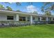 Exterior view of a light-colored building with a neatly landscaped lawn at 11200 102Nd Ave # 60, Seminole, FL 33778