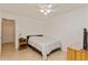 Bright bedroom with a double bed, ceiling fan and hardwood floors at 11200 102Nd Ave # 60, Seminole, FL 33778