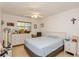 Cozy bedroom with light flooring and a ceiling fan at 11200 102Nd Ave # 60, Seminole, FL 33778