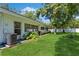 Spacious backyard with lush green grass and mature trees at 11200 102Nd Ave # 60, Seminole, FL 33778