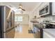 Bright kitchen featuring stainless steel appliances and light wood flooring at 11200 102Nd Ave # 60, Seminole, FL 33778