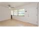 Light and airy living room with wood flooring and large windows at 11200 102Nd Ave # 60, Seminole, FL 33778