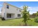 Large backyard with lush green grass and a modern two-story home at 4017 W Fig St, Tampa, FL 33609